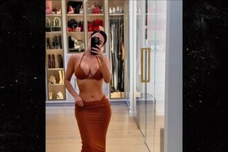kim kardashian models skimpy bikinis in lavish bedroom 683cc230c37ce