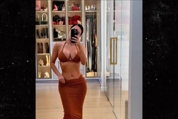 kim kardashian models skimpy bikinis in lavish bedroom 683cc230c37ce