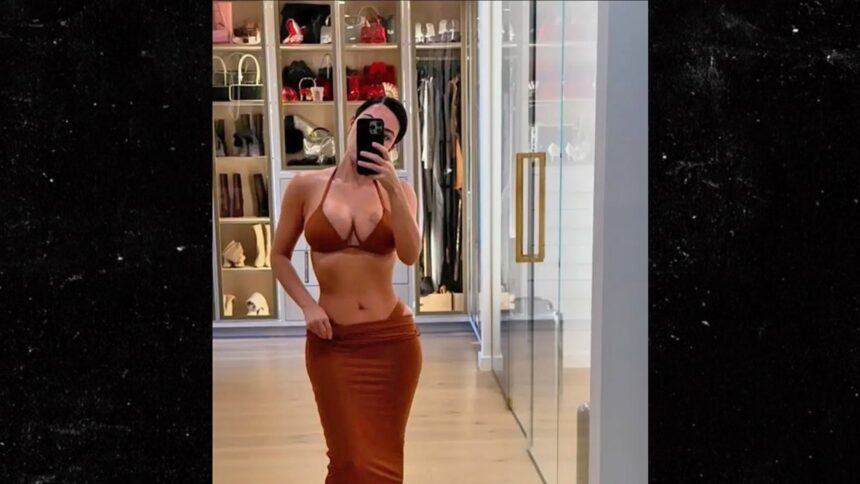 kim kardashian models skimpy bikinis in lavish bedroom 683cc230c37ce