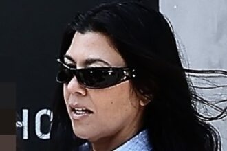 kourtney kardashian ditches pants as she steps out in a button up with son rocky 685b61f835b2e