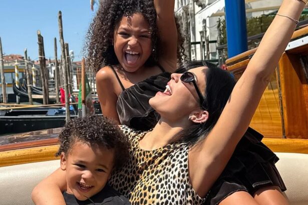 kylie jenner goes from sipping wine to sweet mom mode with stormi and aire at bezos sanchez wedding 68619da9d5751