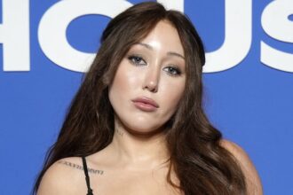 miley cyrus sister noah shares cryptic message while drinking beer in a bikini after dramatic family feud 685c16277864f