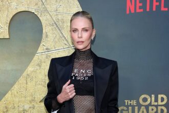 single charlize theron reveals what men lie about on celebrity dating app raya 685f106dcc43d