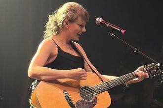 taylor swift fans are convinced shes about to release a country album as she drops major clues onstage 685c5e791f415
