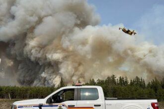 thousands evacuated in three canadian provinces as wildfires continue 683e0e375dc10