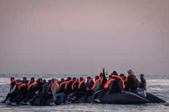 dinghies at dawn and a determination to arrive on the french coast waiting to cross to uk 6870192378274