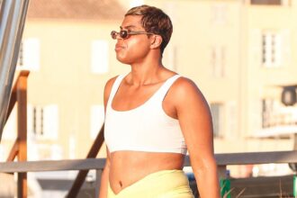 ej johnson flashes tummy in bra top and sarong in saint tropez on vacation with father magic johnson 68791323d7a31