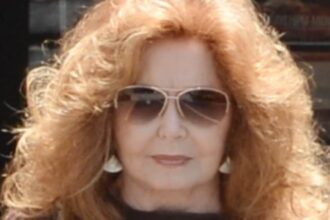 exclusive70s soap legend shows off her famous red curls in rare outing on her 81st birthday can you guess who 68726bbb94969