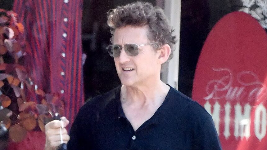 exclusiveiconic 80s star looks shockingly youthful on his 60th birthday during rare outing can you guess who it is 6879458c9e014