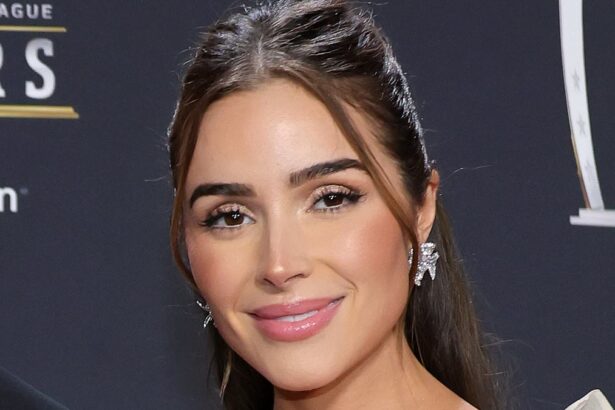 olivia culpo fans think she is pregnant with twins as she poses in a bikini with husband christian mccaffrey 686bd4e84803b
