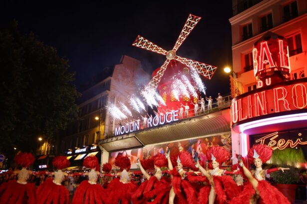 paris rejoices as moulin rouge windmill sails turn again year after collapse 687112f65bc8e