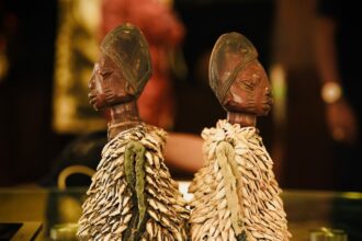 seeing double the wooden carvings that celebrate the yorubas unique connection to twins 68e5e29dc5b88